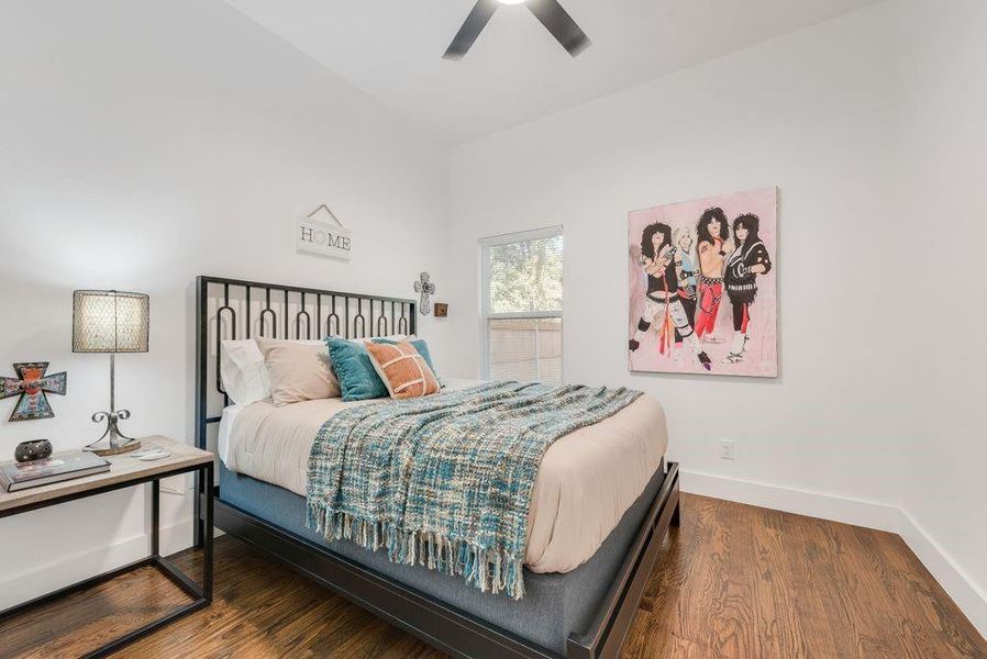 Bedroom featuring wood finished floors and ceiling fan