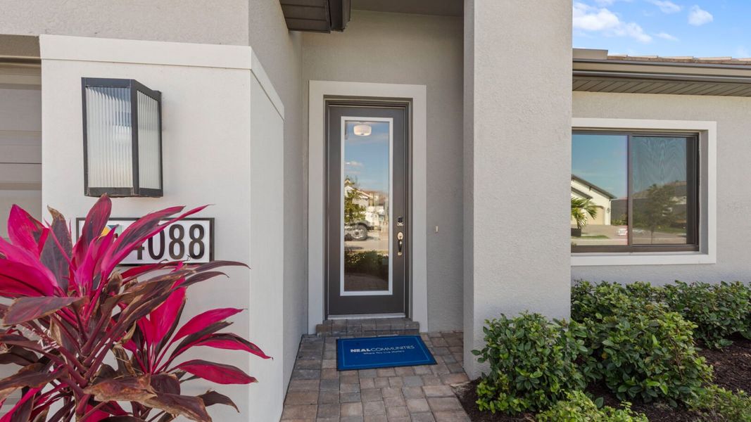 Exterior details and patio area of a home in SkySail, Naples (Image 3).