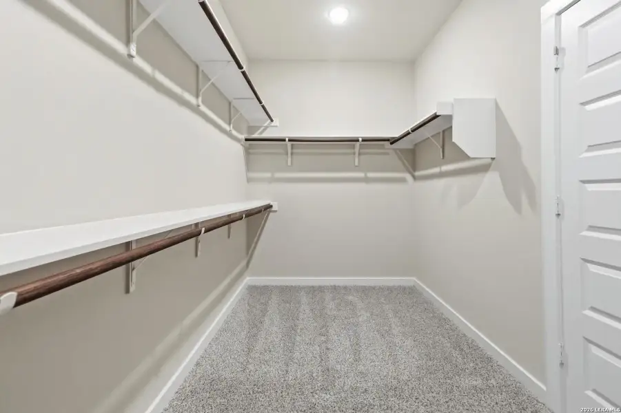 Spacious, unfurnished interior of a new home in Hunters Ranch, San Antonio (Image 22).