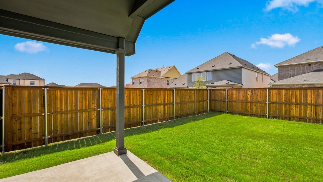 Exterior details and patio area of a home in Green Meadows Premier, Celina (Image 3).