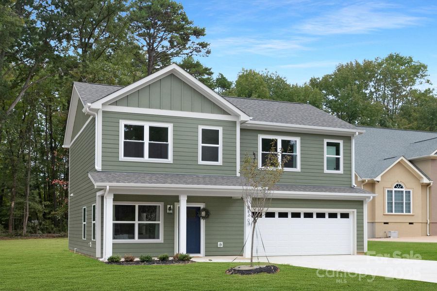 Front exterior of a new home in , Charlotte, NC, highlighting curb appeal (Image 1).