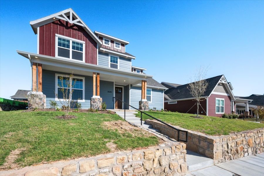 Front exterior of a new home in Heritage Towne, Midlothian, TX, highlighting curb appeal (Image 26).