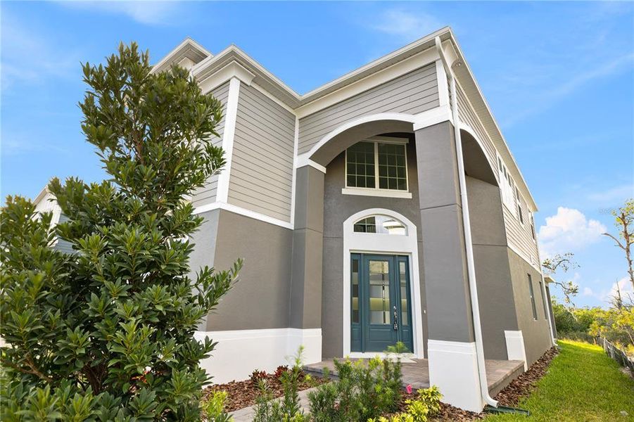 Front exterior of a new home in , Winter Garden, FL, highlighting curb appeal (Image 33). Front exterior of a new home in , Winter Garden, FL, highlighting curb appeal (Image 33).