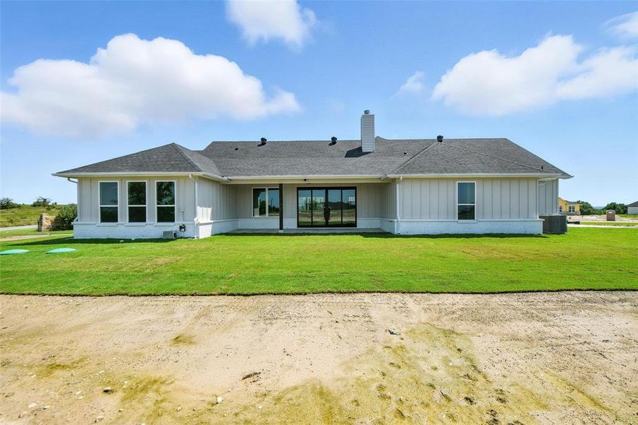 Front exterior of a new home in Rocky Top Ranch, Reno, TX, highlighting curb appeal (Image 21). Front exterior of a new home in Rocky Top Ranch, Reno, TX, highlighting curb appeal (Image 21).
