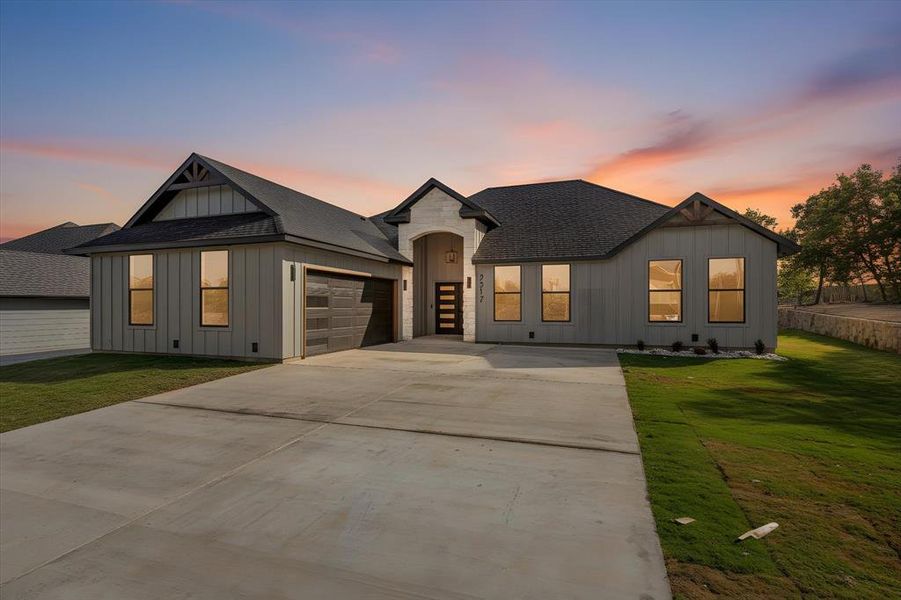 Front exterior of a new home in , Granbury, TX, highlighting curb appeal (Image 1). Front exterior of a new home in , Granbury, TX, highlighting curb appeal (Image 1).