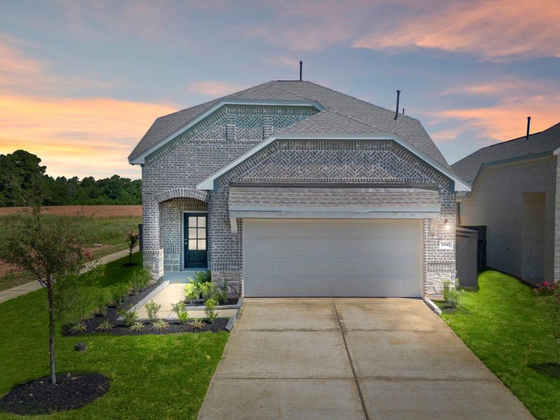 Front exterior of a new home in Emory Glen, Magnolia, TX, highlighting curb appeal (Image 2). Front exterior of a new home in Emory Glen, Magnolia, TX, highlighting curb appeal (Image 2).