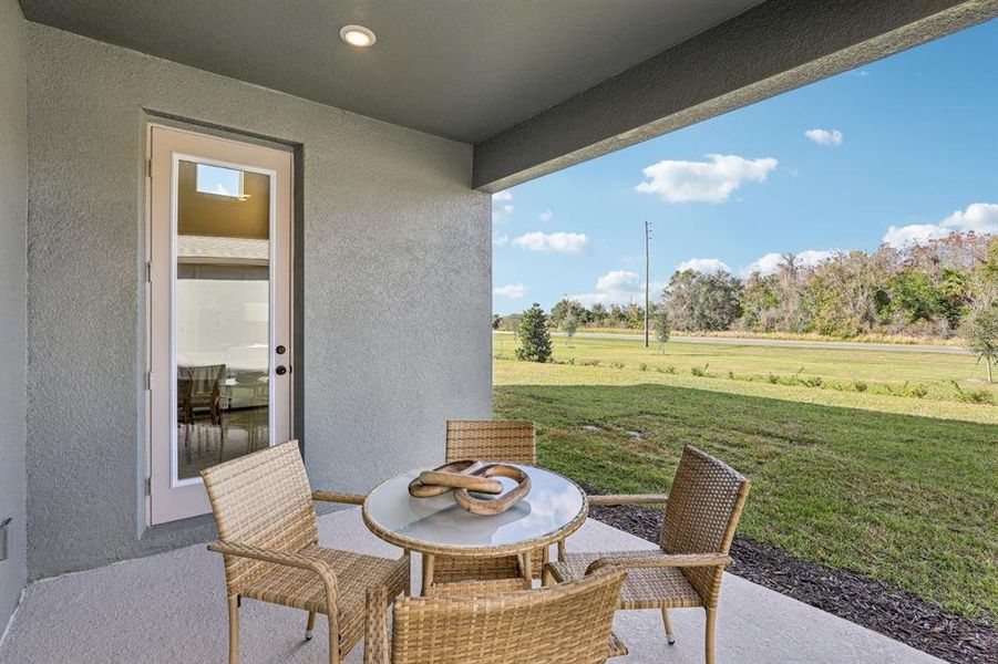 Exterior details and patio area of a home in Hawks Run, Kissimmee (Image 26).