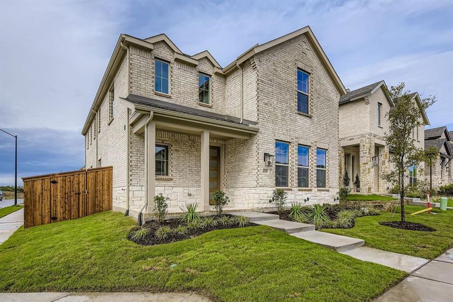 View of front of property with a front lawn and brick siding View of front of property with a front lawn and brick siding