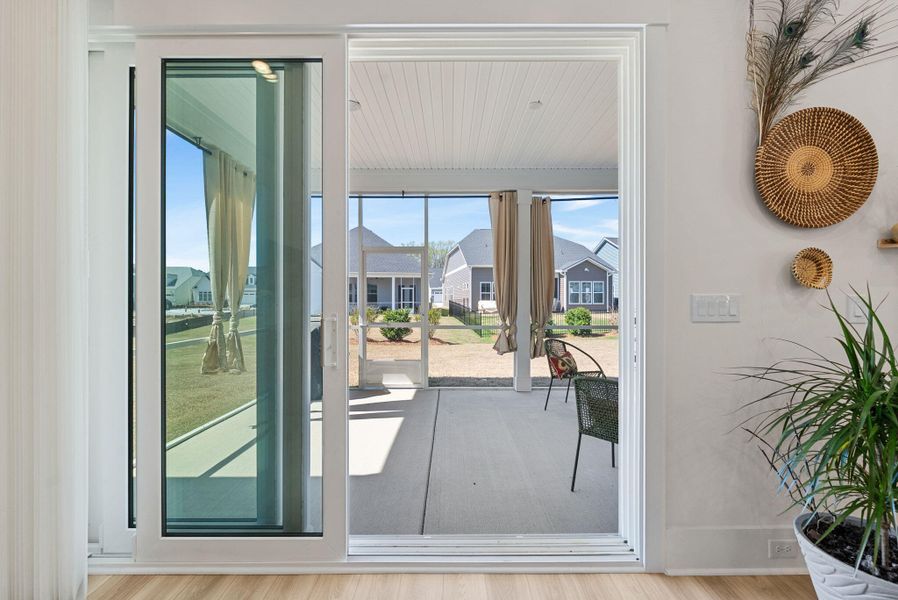 Exterior details and patio area of a home in Summerwind Crossing at Lakes of Cane Bay, Summerville (Image 32).