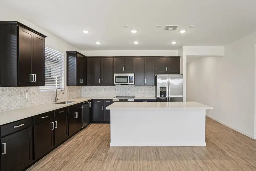 Kitchen featuring the Roosevelt Collection. Not actual home, finishes may vary by community. Kitchen featuring the Roosevelt Collection. Not actual home, finishes may vary by community.