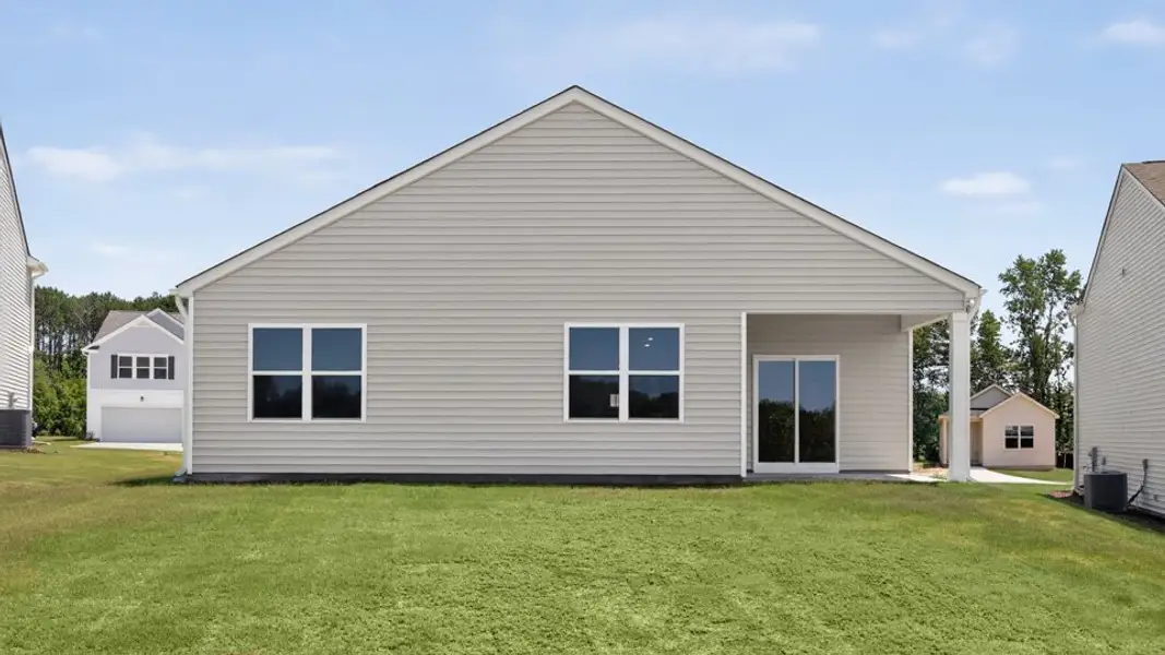 Exterior details and patio area of a home in The Grove at Matthews Landing, Fuquay Varina (Image 4).