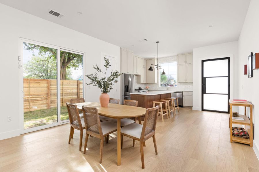 Dining area with light wood finished floors and baseboards Dining area with light wood finished floors and baseboards