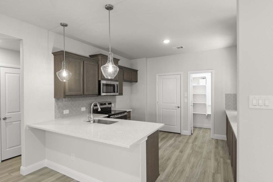 Furnished interior view inside a new home in Keeneland, Aubrey (Image 5). Furnished interior view inside a new home in Keeneland, Aubrey (Image 5).