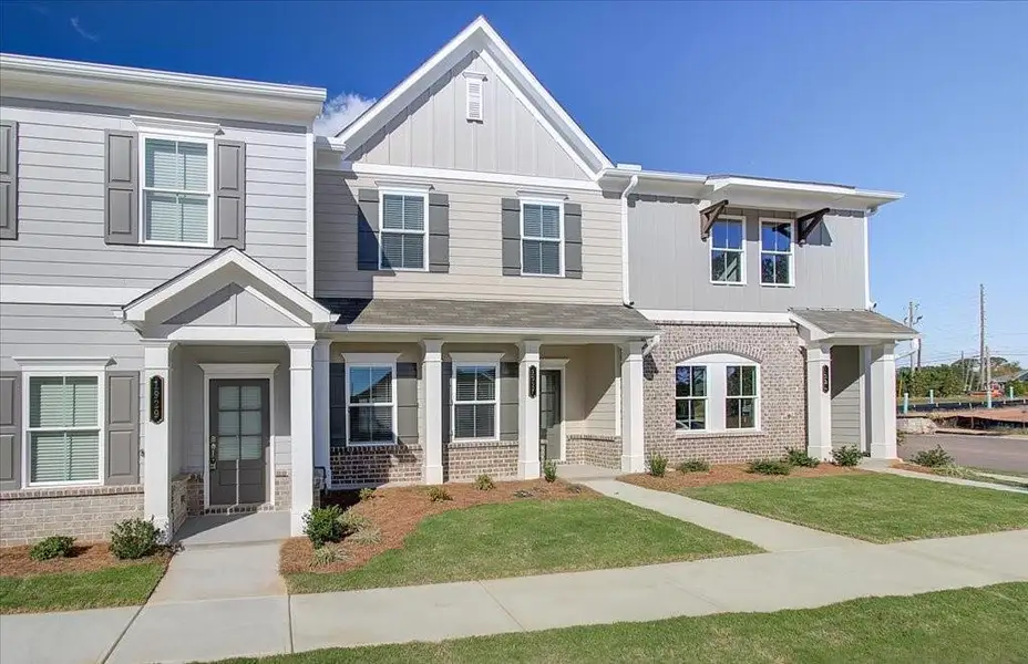 Front exterior of a new home in Wildwood Place, Powder Springs, GA, highlighting curb appeal (Image 23).