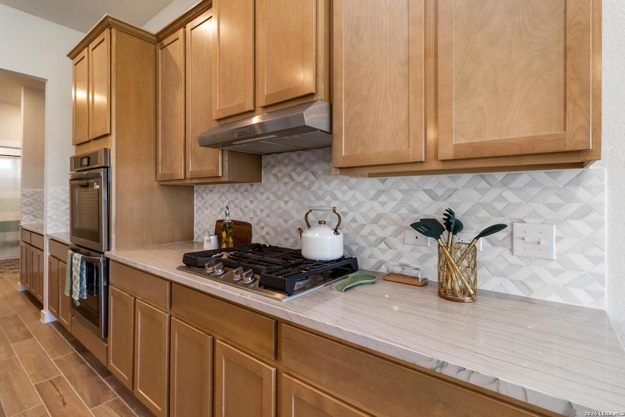 Furnished interior view inside a new home in Alamo Estates, San Antonio (Image 28).
