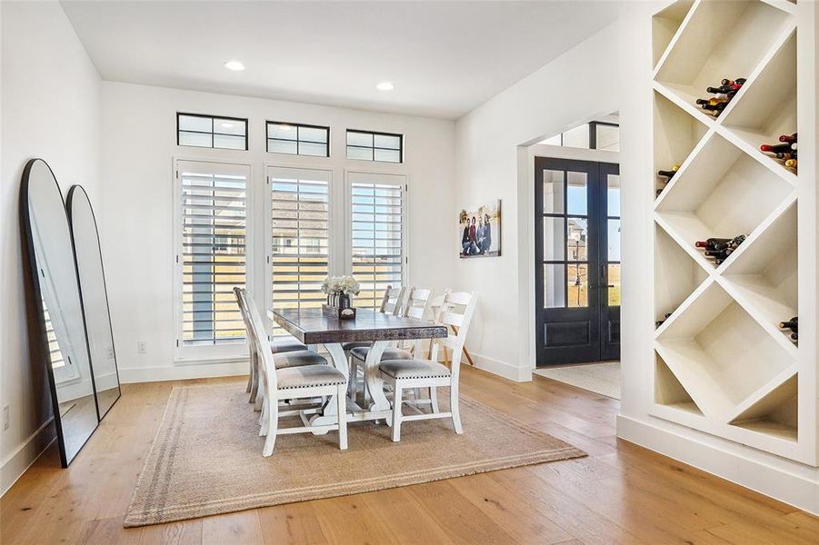 Beautiful dining area that features a custom wine wall