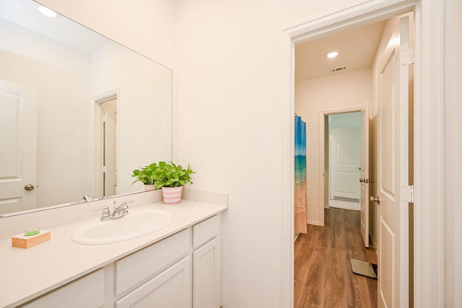 This secondary bathroom is a well-balanced blend of simplicity and charm. This secondary bathroom is a well-balanced blend of simplicity and charm.