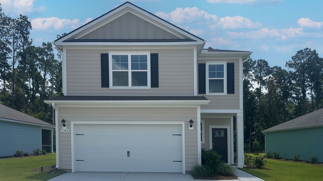 Front exterior of a new home in Hemingway Landing, Conway, SC, highlighting curb appeal (Image 1). Front exterior of a new home in Hemingway Landing, Conway, SC, highlighting curb appeal (Image 1).