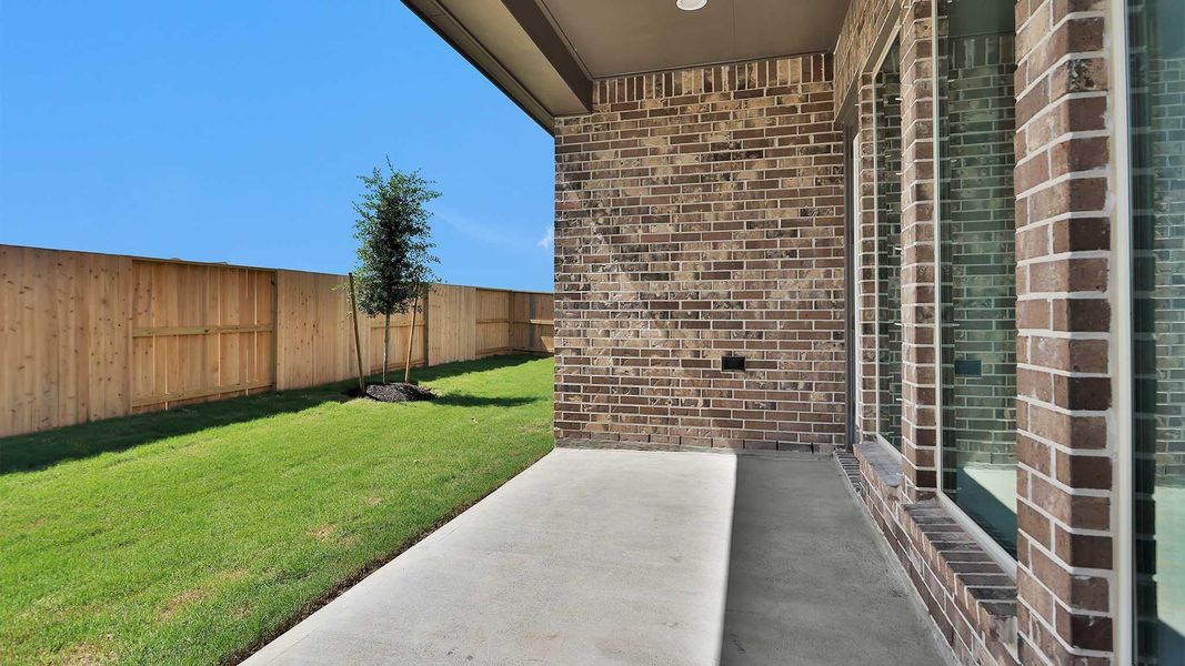 Exterior details and patio area of a home in Meridiana, Manvel (Image 3).