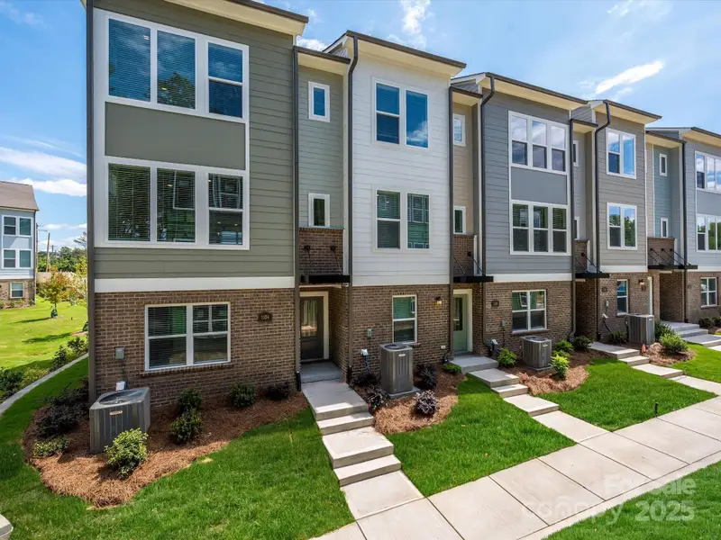 Front exterior of a new home in Central Living at Craig, Charlotte, NC, highlighting curb appeal (Image 19).