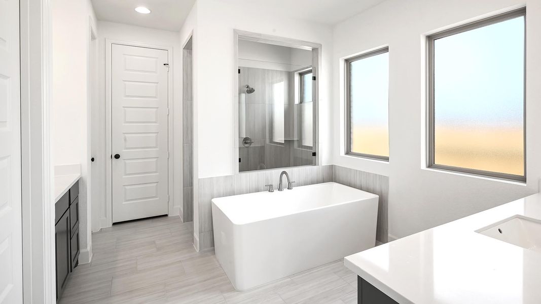 Bathroom featuring vanity, a freestanding bath, a shower, and recessed lighting Bathroom featuring vanity, a freestanding bath, a shower, and recessed lighting