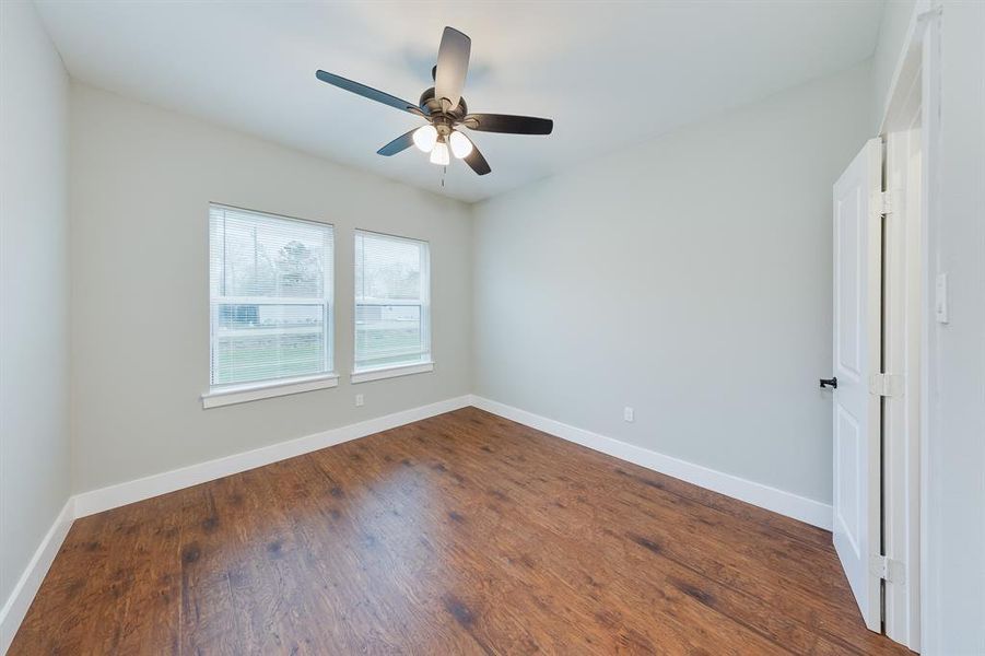 Third bedroom filled with natural light, creating a bright and airy space perfect for rest or a home office.