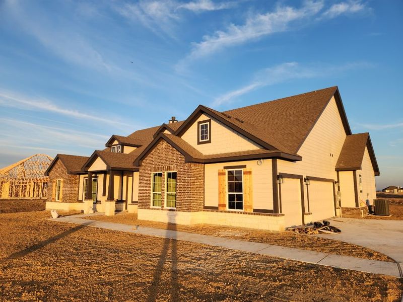 Front exterior of a new home in Rocky Top, Krum, TX, highlighting curb appeal (Image 2). Front exterior of a new home in Rocky Top, Krum, TX, highlighting curb appeal (Image 2).