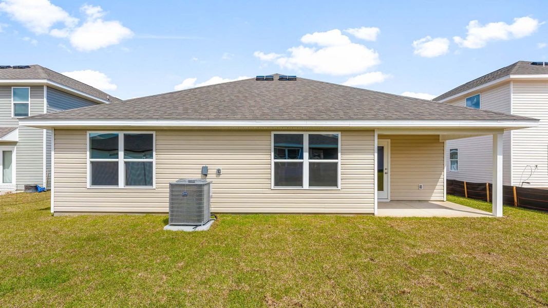 Front exterior of a new home in Titus Park, Panama City, FL, highlighting curb appeal (Image 15).