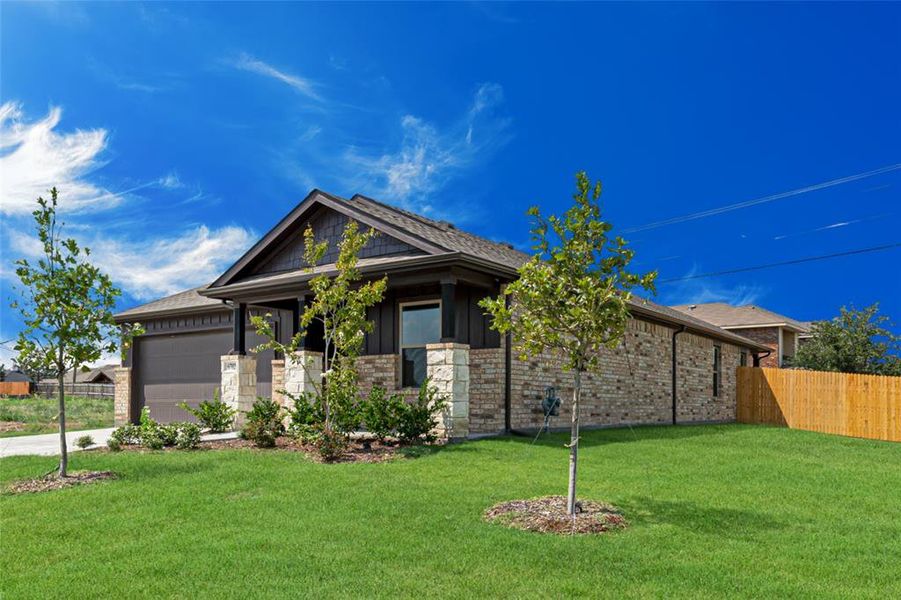 Front exterior of a new home in Bridgepoint, Greenville, TX, highlighting curb appeal (Image 2). Front exterior of a new home in Bridgepoint, Greenville, TX, highlighting curb appeal (Image 2).