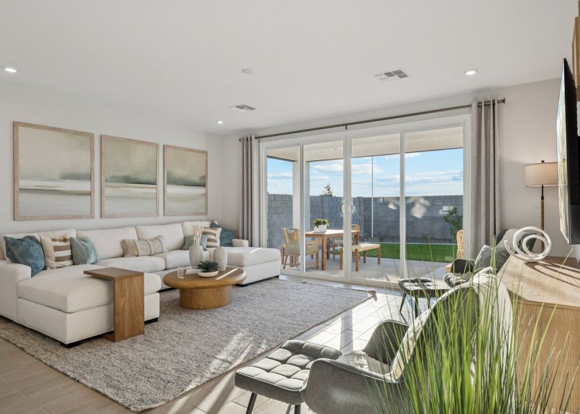 A living room with a large window. A living room with a large window.