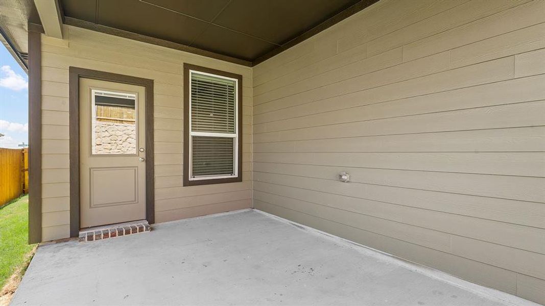 Covered back Patio - All Home and community information, including pricing, included features, terms, availability and amenities, are subject to change at any time without notice or obligation. All Drawings, pictures, photographs, video, square footages, floor plans, elevations, features, colors and sizes are approximate for illustration purposes only and will vary from the homes as built.