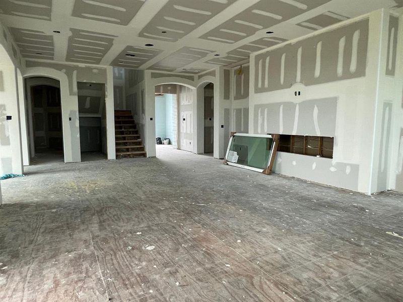 Looking toward the front entry and central stairwell, this shot highlights the home’s oversized under-the-stair closet and future elevator shaft—making beach life accessible for all generations and gear-friendly. Looking toward the front entry and central stairwell, this shot highlights the home’s oversized under-the-stair closet and future elevator shaft—making beach life accessible for all generations and gear-friendly.