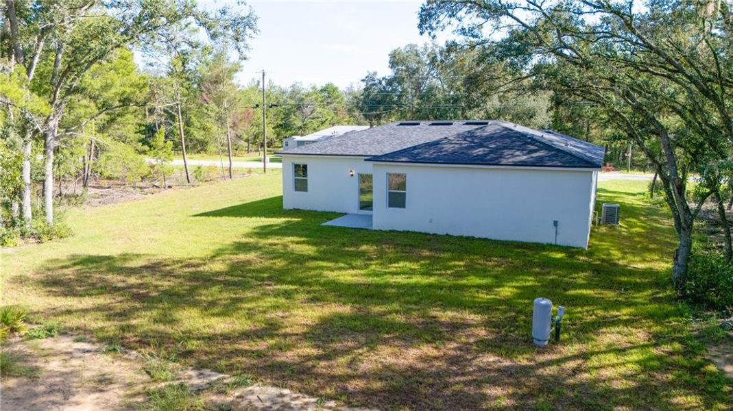 Front exterior of a new home in , Ocklawaha, FL, highlighting curb appeal (Image 1).