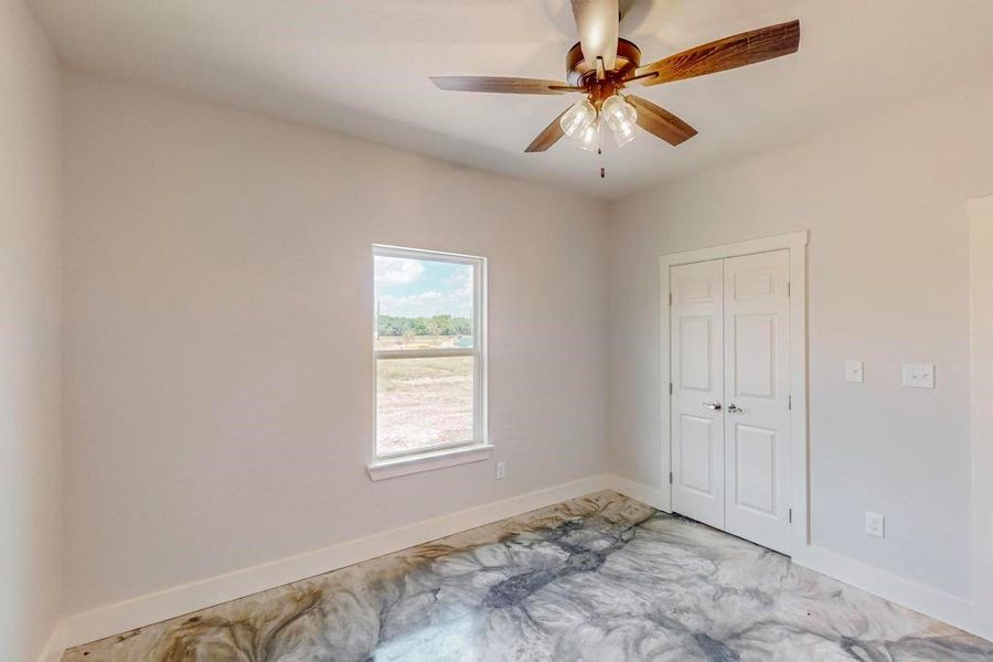 Spare room featuring ceiling fan