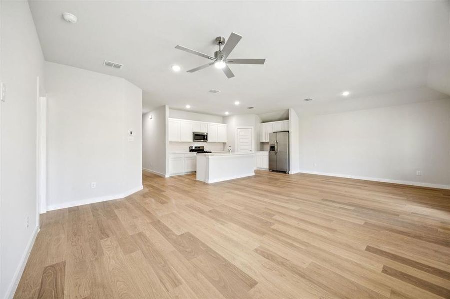 Open Floor Plan in the Emmy II home plan by Trophy Signature Homes - REPRESENTATIVE PHOTO