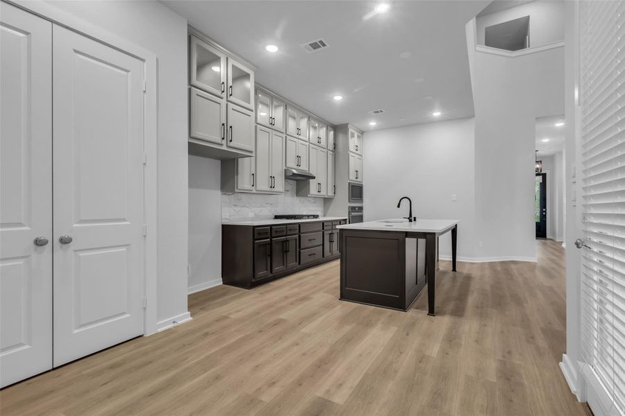 Dining room with double doors to the pantry.