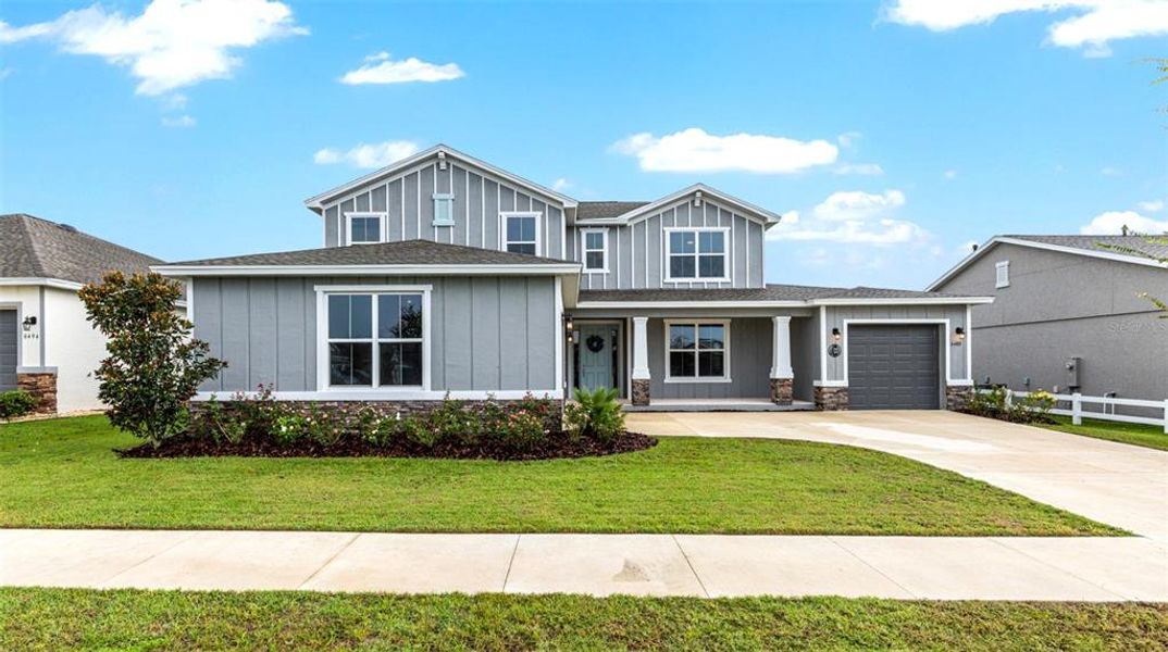 Front exterior of a new home in Calesa Township, Ocala, FL, highlighting curb appeal (Image 25).