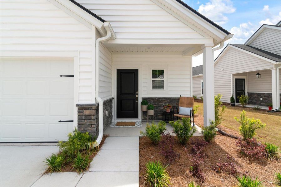 Exterior details and patio area of a home in Horizons at Summers Corner | 55+, Summerville (Image 4).