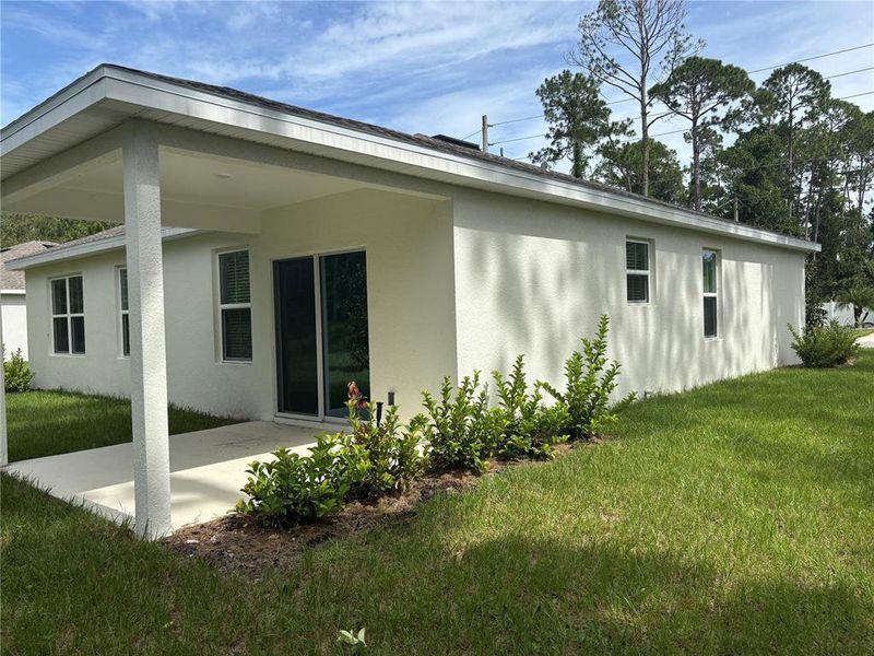 Exterior details and patio area of a home in Aspire at Palm Coast, Palm Coast (Image 25).