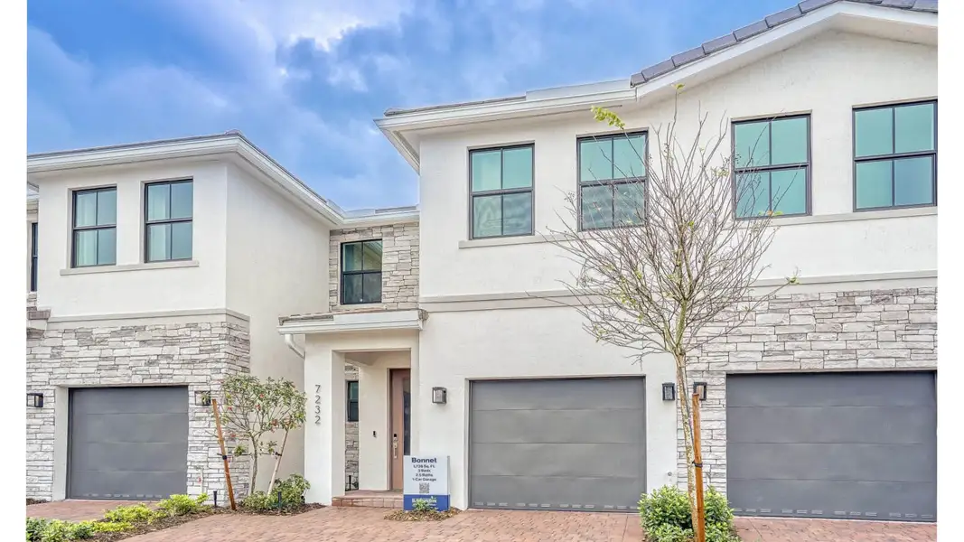Front exterior of a new home in Vineyards, Davie, FL, highlighting curb appeal (Image 18). Front exterior of a new home in Vineyards, Davie, FL, highlighting curb appeal (Image 18).