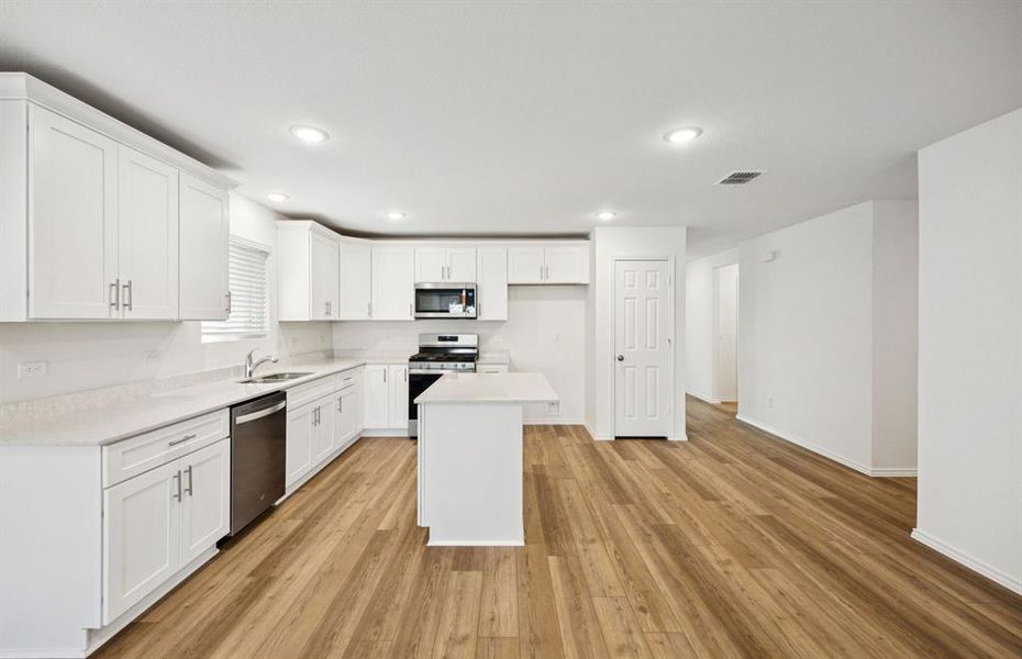 Spacious kitchen with eat-in bar top island Spacious kitchen with eat-in bar top island