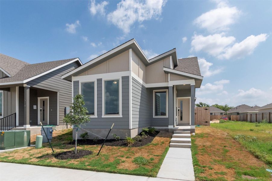 Front exterior of a new home in Blanco Vista, San Marcos, TX, highlighting curb appeal (Image 23).