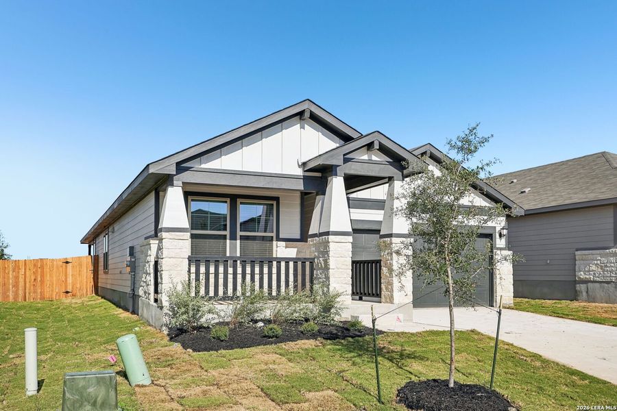 Front exterior of a new home in Remington Ranch, San Antonio, TX, highlighting curb appeal (Image 24).
