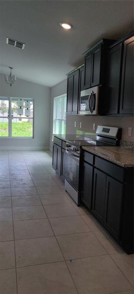 Furnished interior view inside a new home in Sunset Landing, Spring Hill (Image 4).