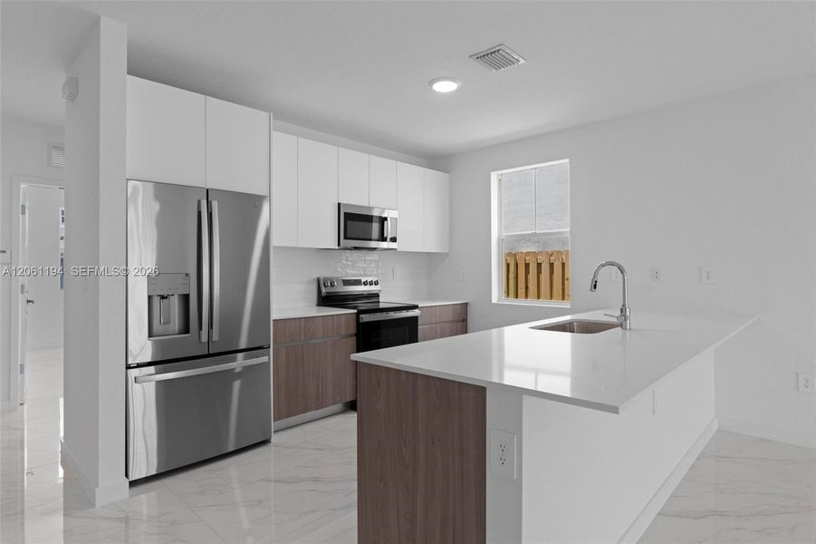 Furnished interior view inside a new home in , Homestead (Image 5). Furnished interior view inside a new home in , Homestead (Image 5).