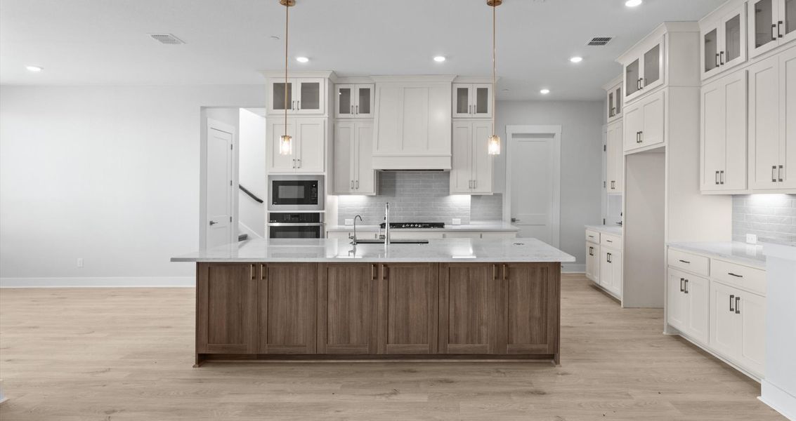 Representative furnished interior of a home built from the Raegan by Chesmar Homes in Sweetwater, Austin (Image 4).