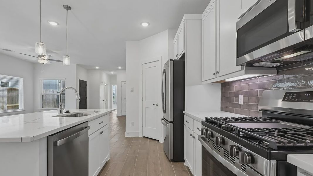 Furnished interior view inside a new home in Meridiana Townhomes, Iowa Colony (Image 9).