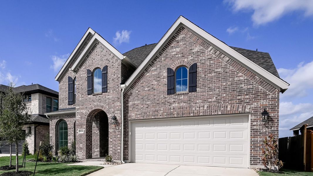 Front exterior of a new home in Crosswinds, Kyle, TX, highlighting curb appeal (Image 16).