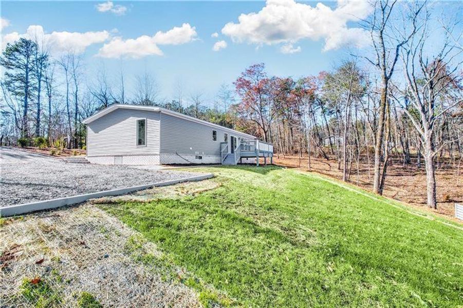 Front exterior of a new home in , Ball Ground, GA, highlighting curb appeal (Image 21).
