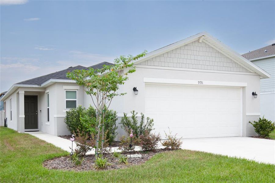 Front exterior of a new home in , Leesburg, FL, highlighting curb appeal (Image 28). Front exterior of a new home in , Leesburg, FL, highlighting curb appeal (Image 28).